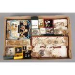 A tray containing a good assortment of costume jewellery, to include cameo brooch, garnet bead