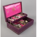 A cantilever jewellery box with contents of costume jewellery. Includes brooches, rings and dress
