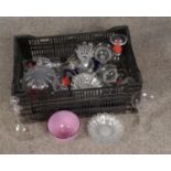 A box of modern glassware including dishes, tea cups, coloured examples.