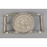 A Jostens sterling silver belt buckle featuring PR engraved initials. Total weight 87.5g.