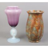 An amethyst and vaseline glass vase with translucent figure of a woman to the stem, together with