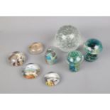 A collection of glass paperweights including souvenir and mushroom shaped examples.