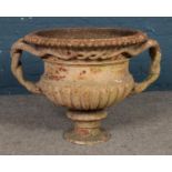 A Victorian cast iron, twin handled planter. Approx. dimensions 75cm x 55cm.