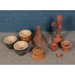 A box of Terracotta planters and ornaments including coloured glazed examples.