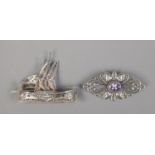 Two silver brooches including filigree boat example.