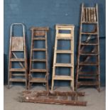Five sets of wooden step ladders. Tallest example 200cm.