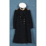 A Royal Navy commanders uniform coat along with corresponding hat. Approximately 40"/Large. Labels