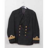 A Royal Navy Lieutenants jacket. Bearing label for Gieves Limited, London.