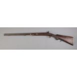 A Nineteenth Century percussion cap rifle, stamped 704 to barrel. Length: 107cm. CANNOT POST