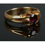 A Victorian 18ct Gold ring set with central garnet. Size R. Total weight: 6.1g