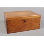An oak cased sewing box with contents of a large quantity of sewing threads.