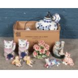 A box of assorted ceramics, to include a pair of lucky cat figures, blue and white lampshade, monkey