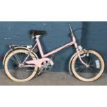 A pink Elswick Shopper bike. Missing handle bar.