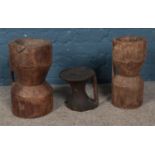 Three carved African grain stompers. Tallest approx. height 41.5cm.