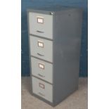 A four drawer filing cabinet. (131cm x 47cm x 62cm)