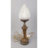 An Art Deco style bronzed figural table lamp on marble base formed as a maiden carrying a torch.