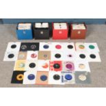 Four carry cases of 1960's and 1970 singles records. To include Bachman-Turner Overdrive, The