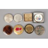 Eight Stratton compacts including butterfly and floral examples.
