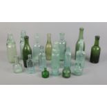 A collection of vintage glass bottles including Ramune and brewery examples.