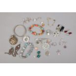 A small collection of assorted costume jewellery including necklaces, earrings, brooches, etc.