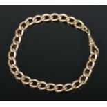 A gold chain link bracelet. 26g, tests as 9ct.