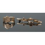 A 9ct floral engraved ring and pin brooch (broken pin). Ring size MÂ½, total weight 2.7g.