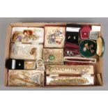 A tray of assorted costume jewellery and accessories, to include boxed rings, butterfly brooch,