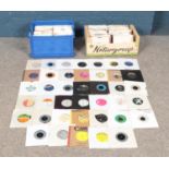 Two boxes of assorted singles records, to include Sonny and Cher, U2, Soft Cell, Rod Stewart,