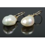 A pair of 9ct Gold mounted freshwater pearl earrings. Length of pearls: 17mm.