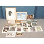 A quantity of paintings and prints. Includes watercolour depicting black Labrador hunting a duck,