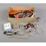 A collection of costume jewellery including earrings, assorted bracelets, beaded necklaces, etc.