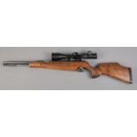 An Air-Arms TX200 cal .177/4.5mm underlever air rifle, with left handed walnut stock. Fitted with