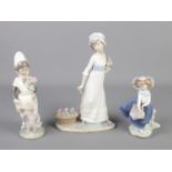 A set of 3 Lladro figures of maidens.