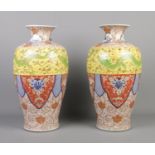 A large pair of Japanese Meiji period baluster shaped vases. Decorated in the Imari style with