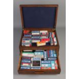 An oak presentation case, with self-locking lower drawer, containing an assortment of boxed radio