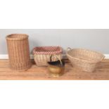 Three wicker baskets of various sizes, together with a swing handled coal scuttle. Tallest 58cm.