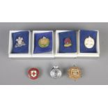 A quantity of cap and lapel badges, to include 10th Royal Hussars, Masonic and Dorsetshire examples.