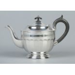 A George V silver teapot with ebonised handle and finial. Assayed Sheffield 1933 by Viner's Ltd (