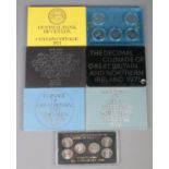 Seven coin packs. Includes Bank of Greece Olympic coins, Central Bank of Ceylon 1971, four Coinage