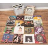 Two boxes of LP records. Includes Queen, Genesis, Jimi Hendrix, Rolling Stones, etc.