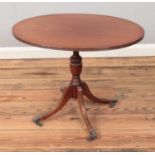 A Regency style mahogany coffee table raised on castors. Approx. dimensions 67cm x 45cm.