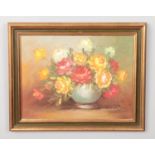 S. Barton gilt framed oil on canvas depicting flora still life of roses in vase. Approx.