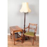 Two pieces of furniture and a standard lamp. Includes a walnut tea trolley with castors and a