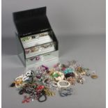 A collection of costume jewellery in a mirrored jewellery box