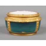 A French Art Nouveau gilt bronze mounted porcelain powder bowl and cover by Paul Louchet, Paris. The