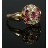 A late Victorian gold ruby and diamond cluster ring. Size M 1/2. 3.79g. Tests as high carat.
