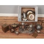 A box of metalwares. Includes pewter teapot, eastern bowl, silver plated tray, etc.
