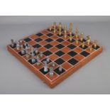 Wooden chess board with pewter and brass pieces