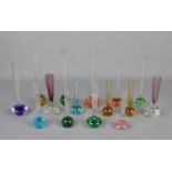 A collection of 15 controlled bubble bud vases in various colours and sizes.