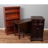 Oak dropleaf table with barley twist legs along with Chinese hardwood cabinet and yew wood bookcase